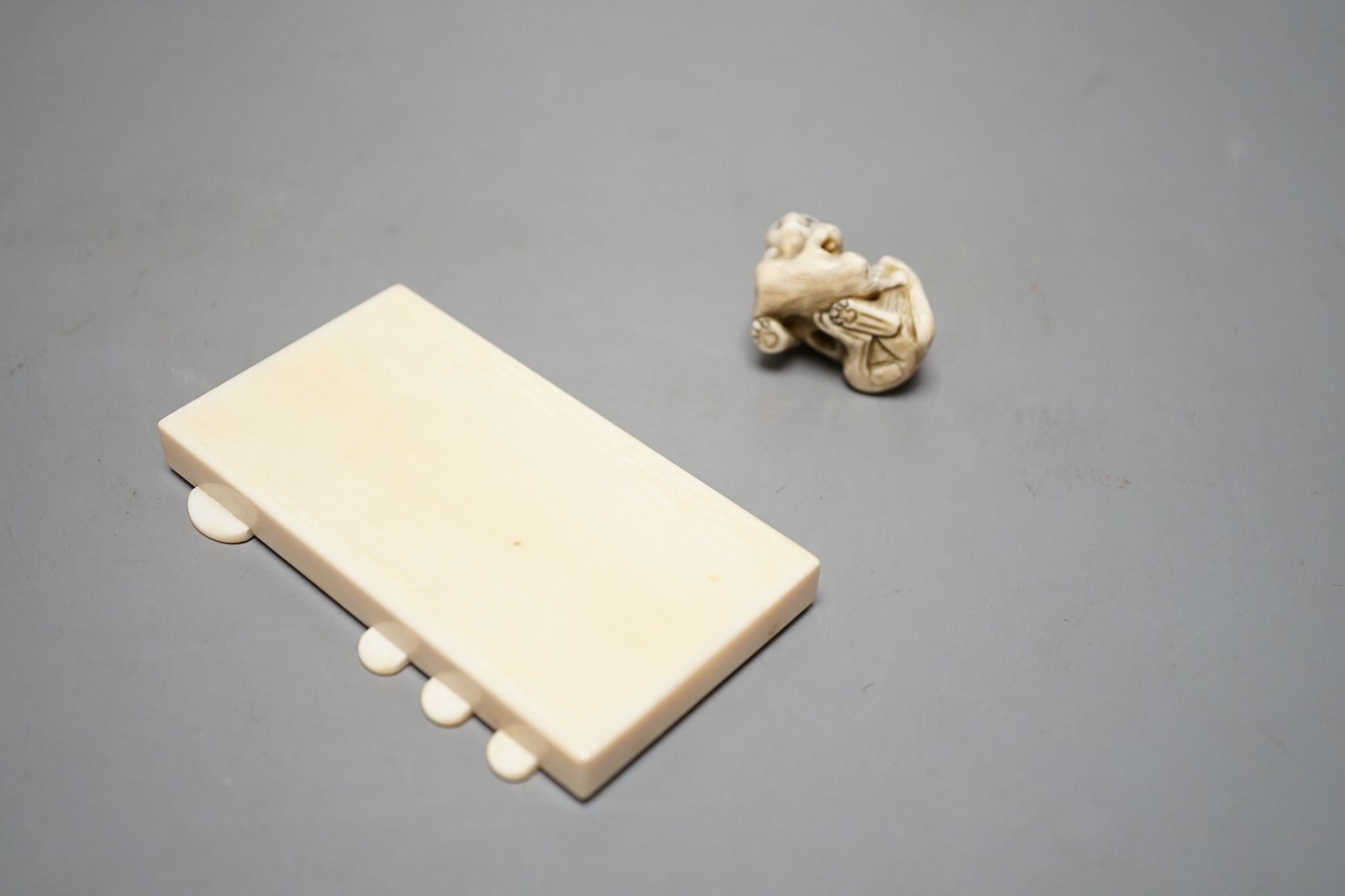 A 19th century ivory netsuke cat group and a Meij period ivory shibayama bezique marker, 9cm.